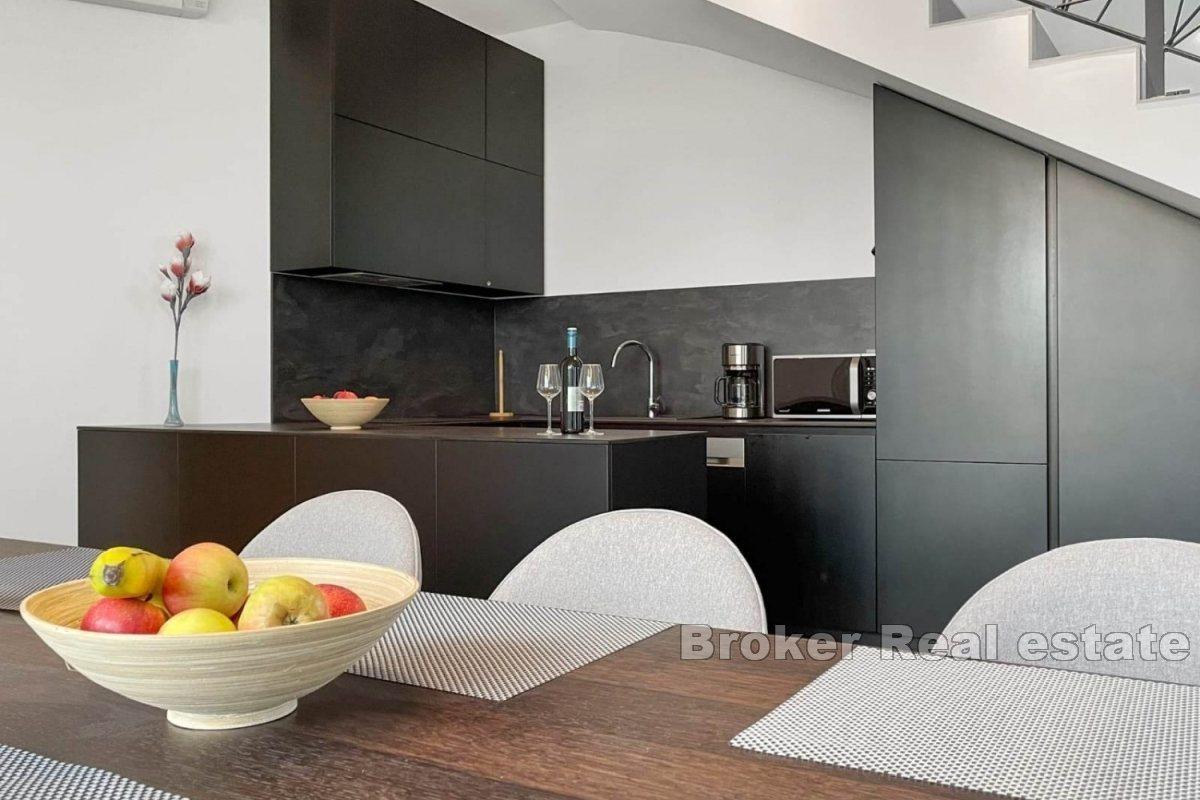 A modern villa surrounded by greenery in a quiet location