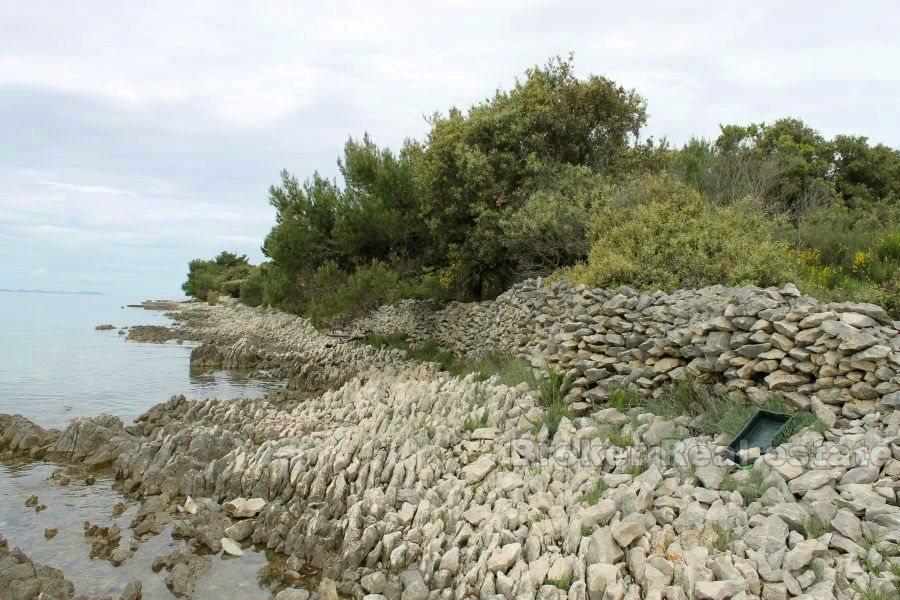 Terrain à bâtir première rangée à la mer, à vendre