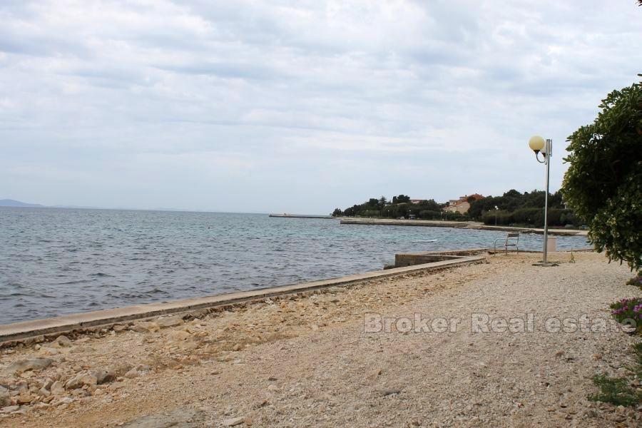 The house / villa with a large garden, seafront