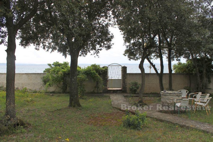 The house / villa with a large garden, seafront