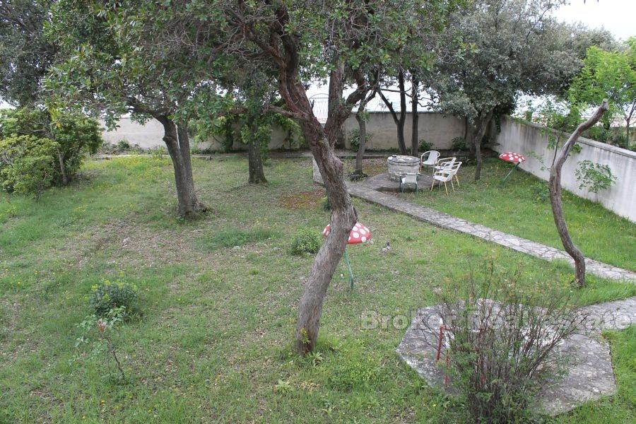 The house / villa with a large garden, seafront