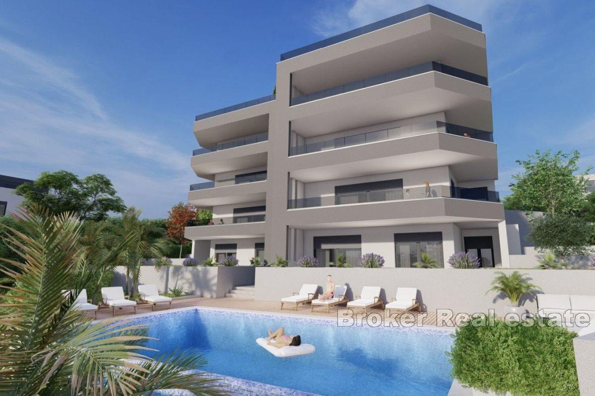 Apartments under construction with swimming pool and open view