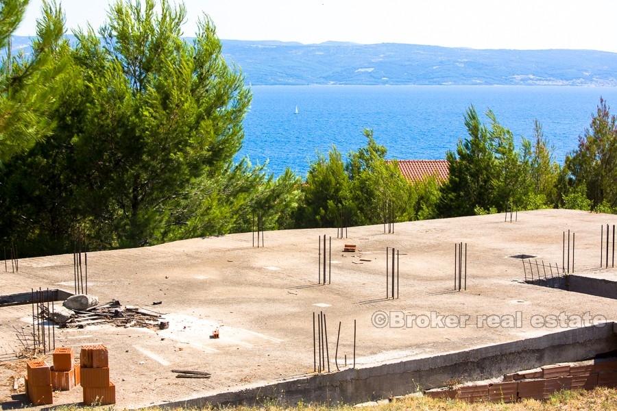 House under construction with sea view