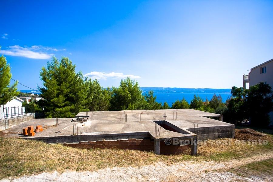 House under construction with sea view