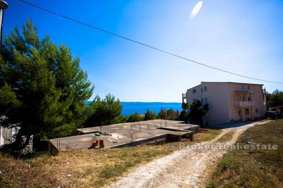 House under construction with sea view