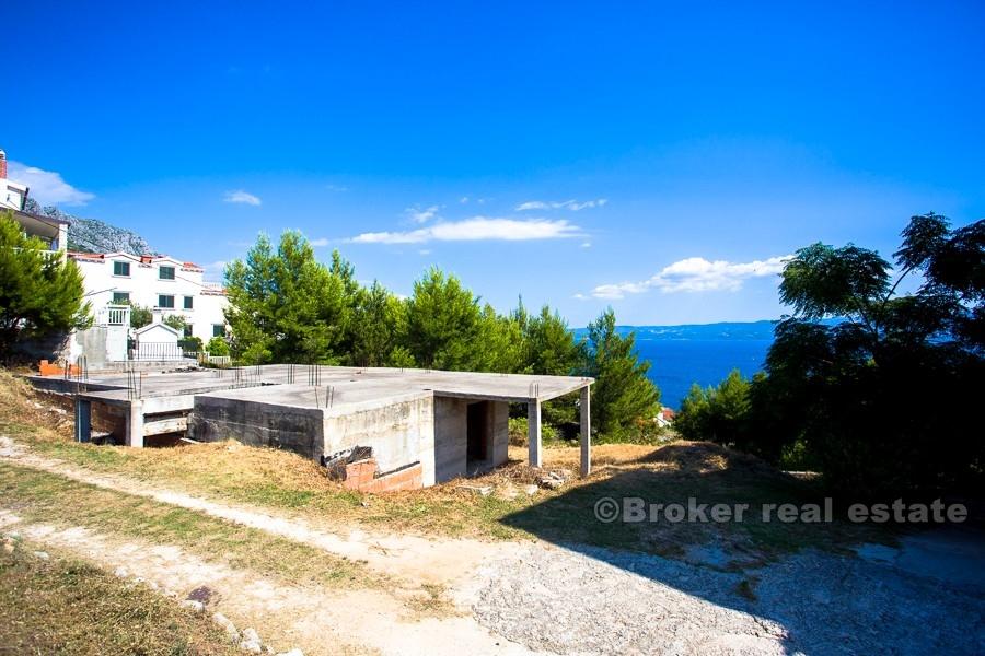 House under construction with sea view