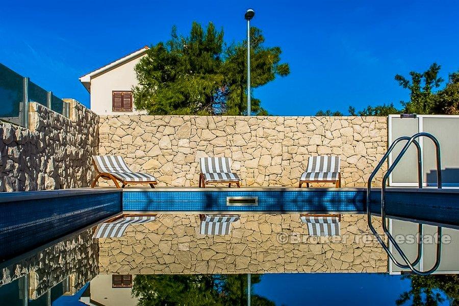 Semi-detached villa with pool, second row from the sea