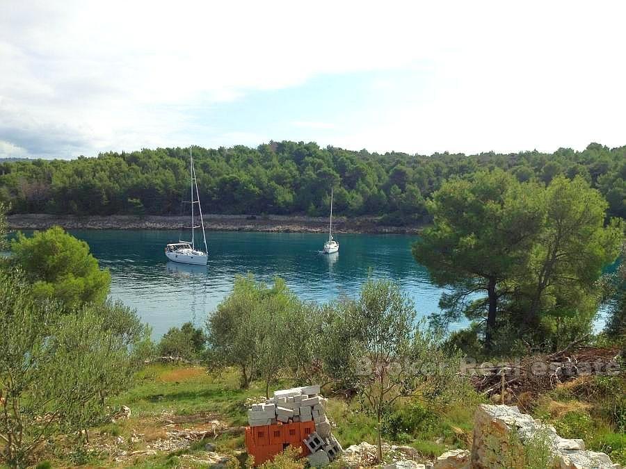 Agricultural land plot with small house at second row to the sea