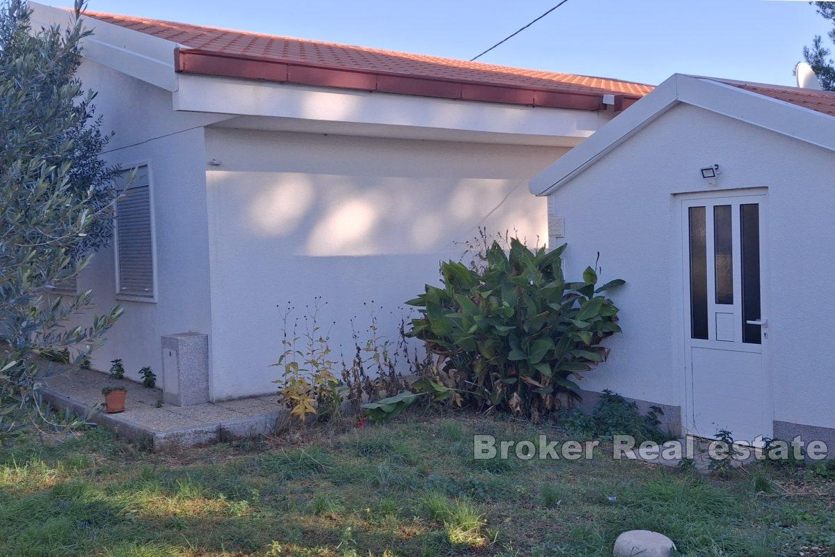 Exclusive building plot in the first row to the sea with three apartments