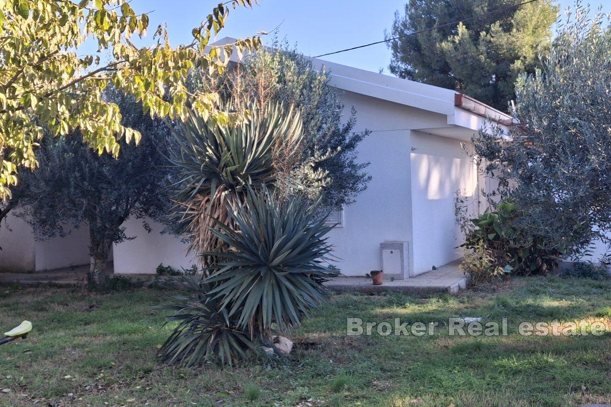 Exclusive building plot in the first row to the sea with three apartments