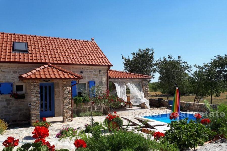 Stone house surrounded by greenery