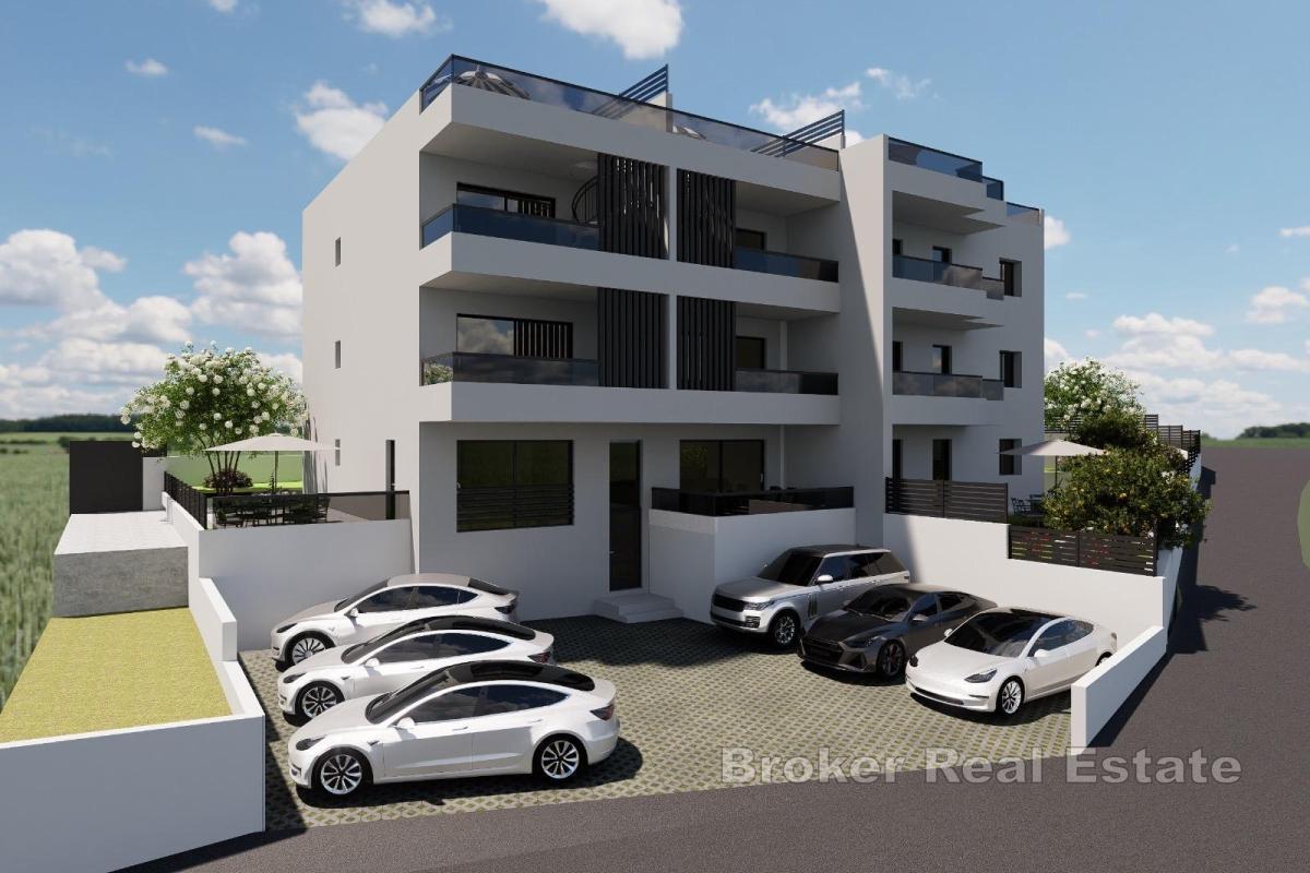 Appartamento in un nuovo edificio con giardino e posto auto