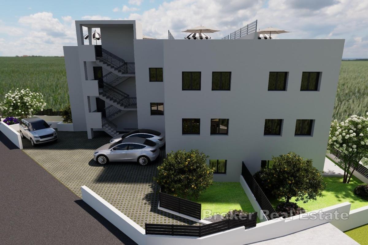 Appartamento in un nuovo edificio con giardino e posto auto
