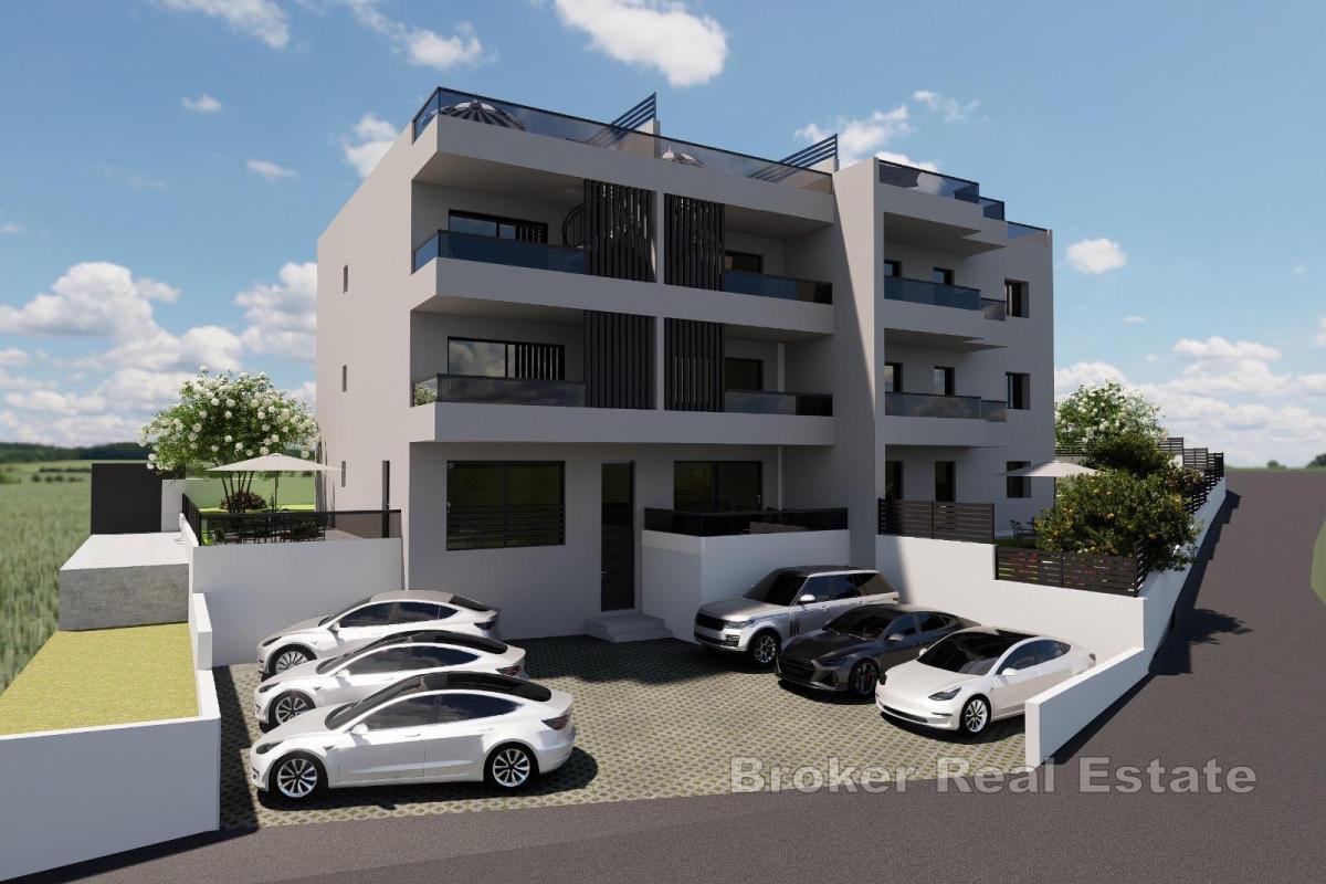 Appartamento in un nuovo edificio con giardino e posto auto