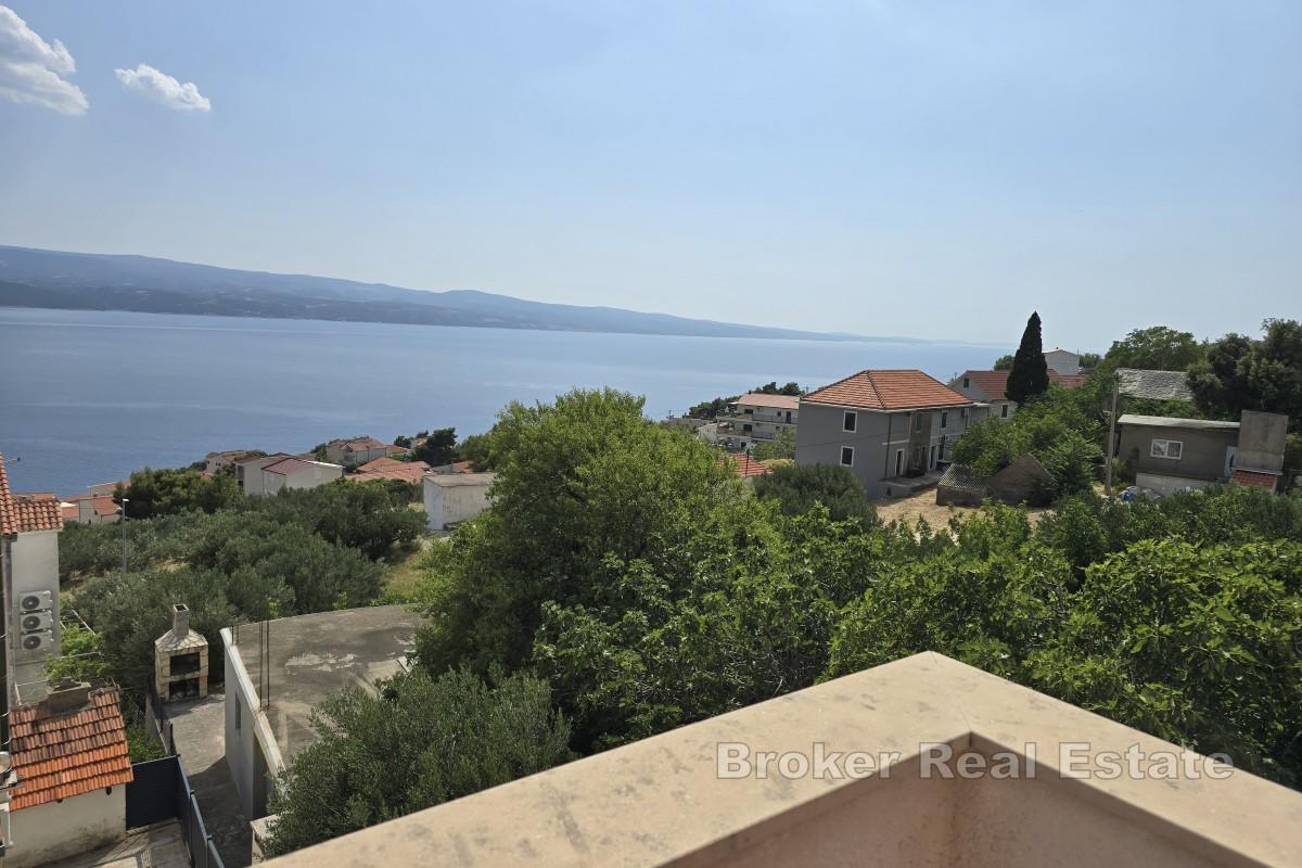 Casa con appartamenti con vista mare aperta